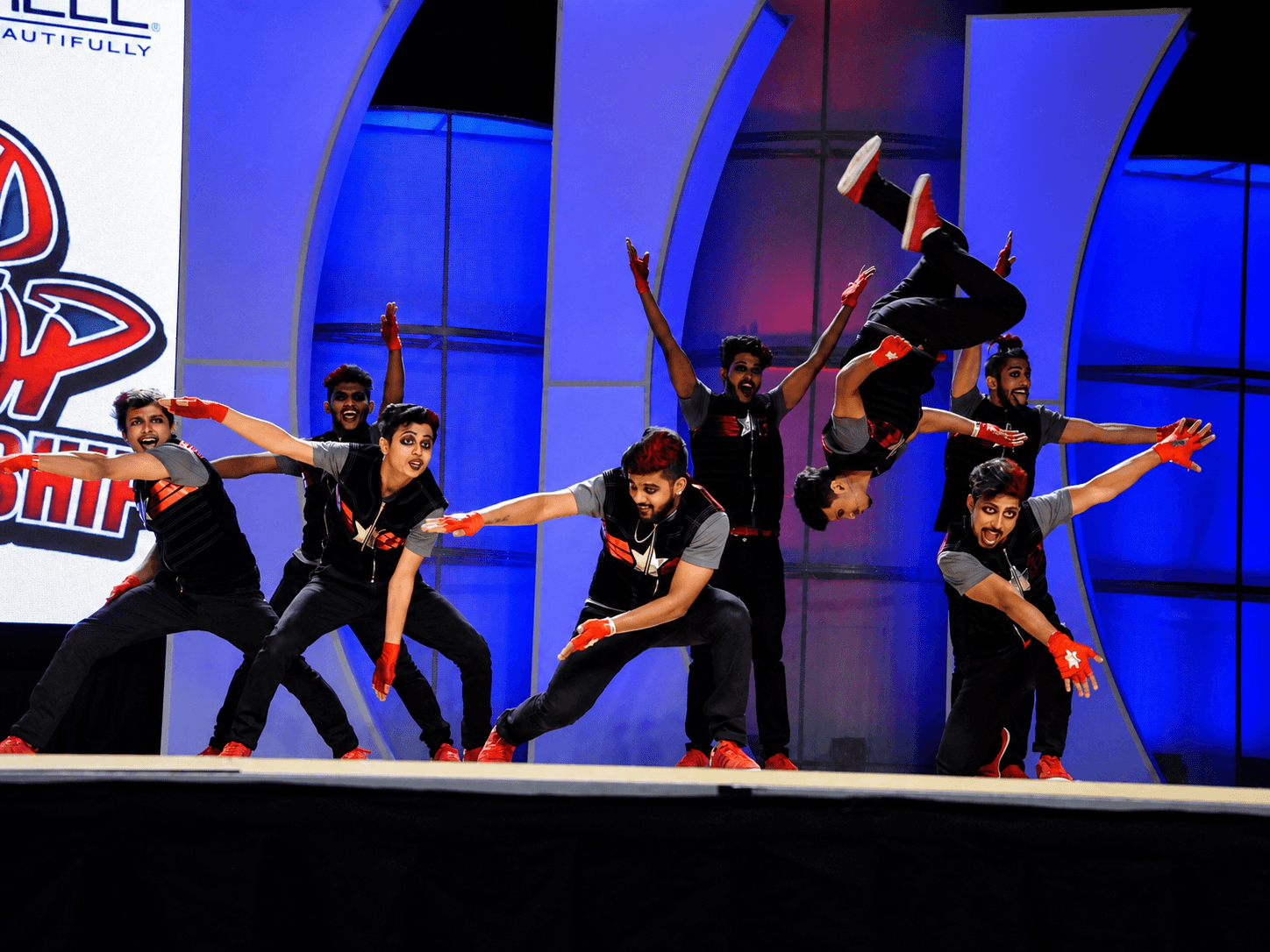 Full-crew formation with aerial flip on the world stage