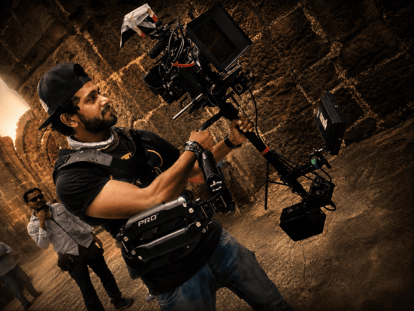 Suresh Mukund operating a steadicam rig on set