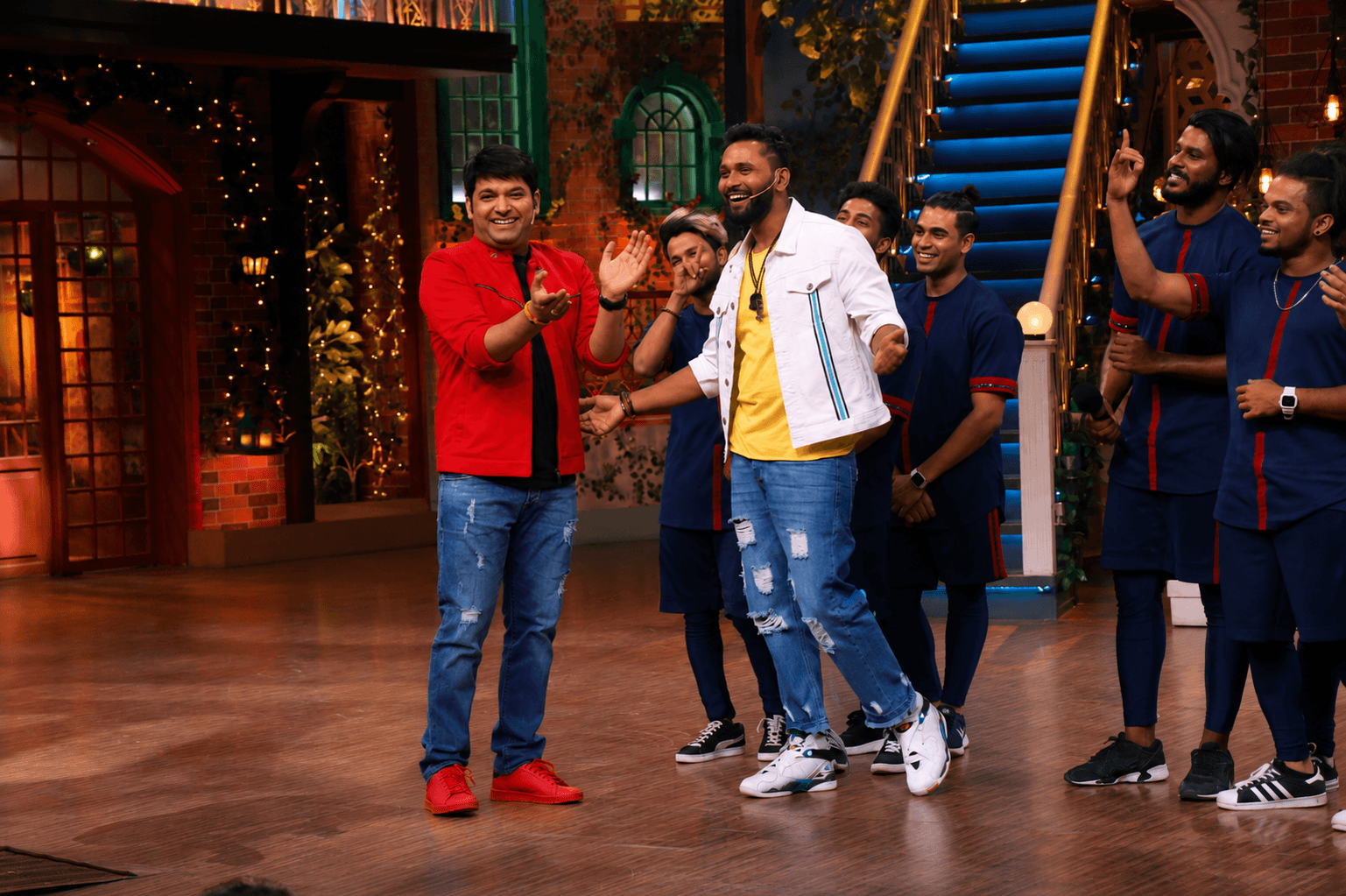 Suresh Mukund on a TV show stage with the crew